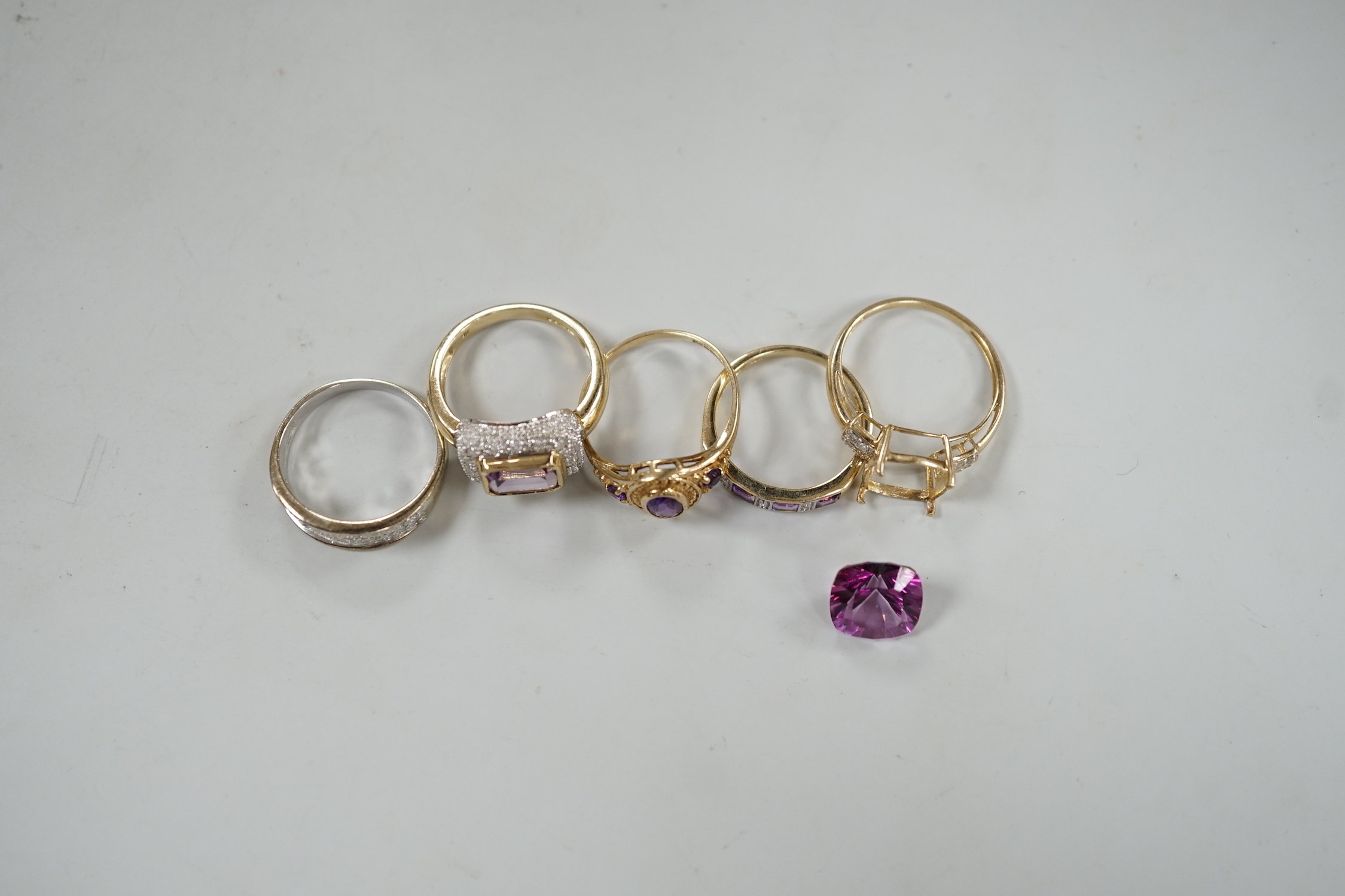 Five assorted modern 9ct gold and gem set dress rings, including diamond chip half hoop and amethyst and diamond chip half hoop, gross weight 12.6 grams.